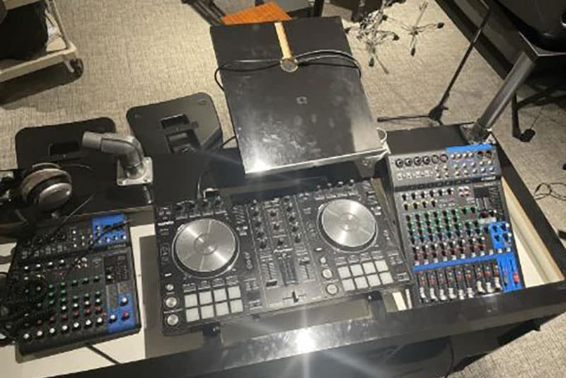 A complete DJ booth, controller and sound system